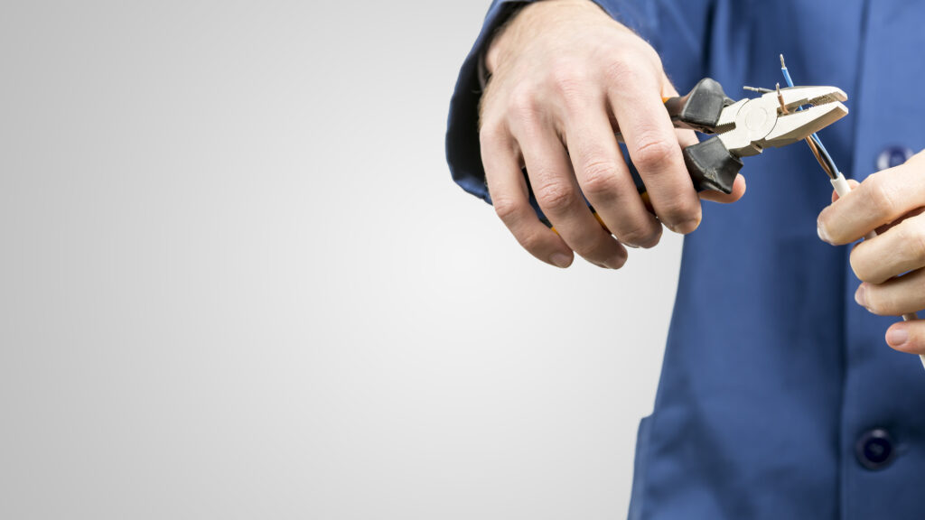 Workman repairing an electrical cable